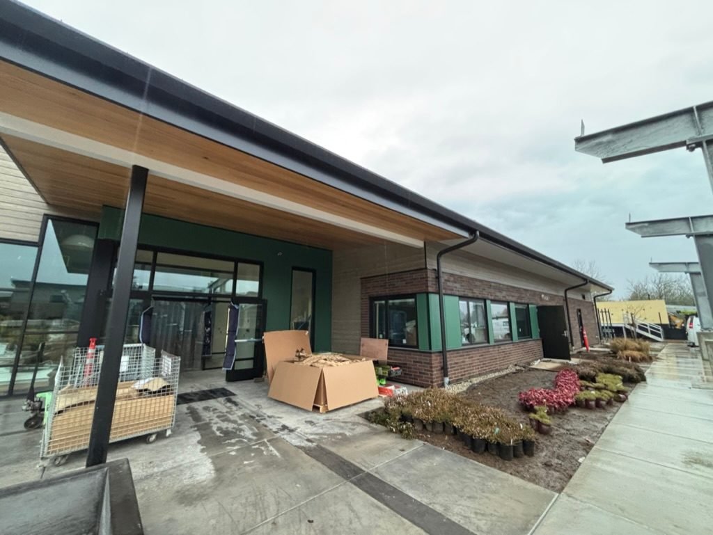 Covered entrance of the DSHS clinic in Vancouver, WA with cedar soffit and brick exterior