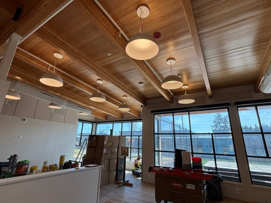 Pendant lighting in a daylit open area with large windows at the DSHS clinic in Vancouver, WA